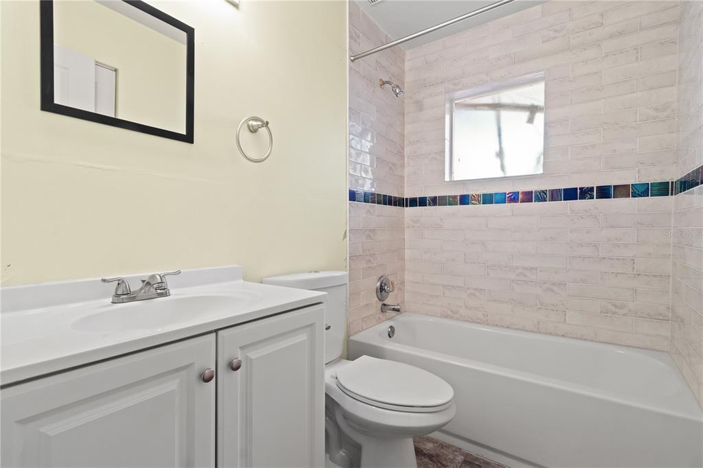 6515 Dimarco Road Tampa, FL 33634 - Photo 29 of 66 a bathroom with a sink and a mirror