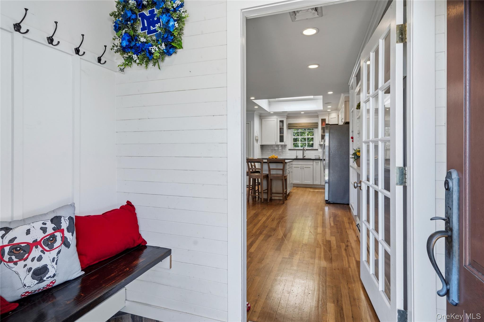 190 Sexton Road West Babylon, NY 11704 - Photo 6 of 28 a hallway with a dining room and wooden floor