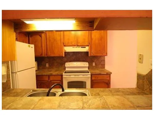 a picture of a room with a table and a chair