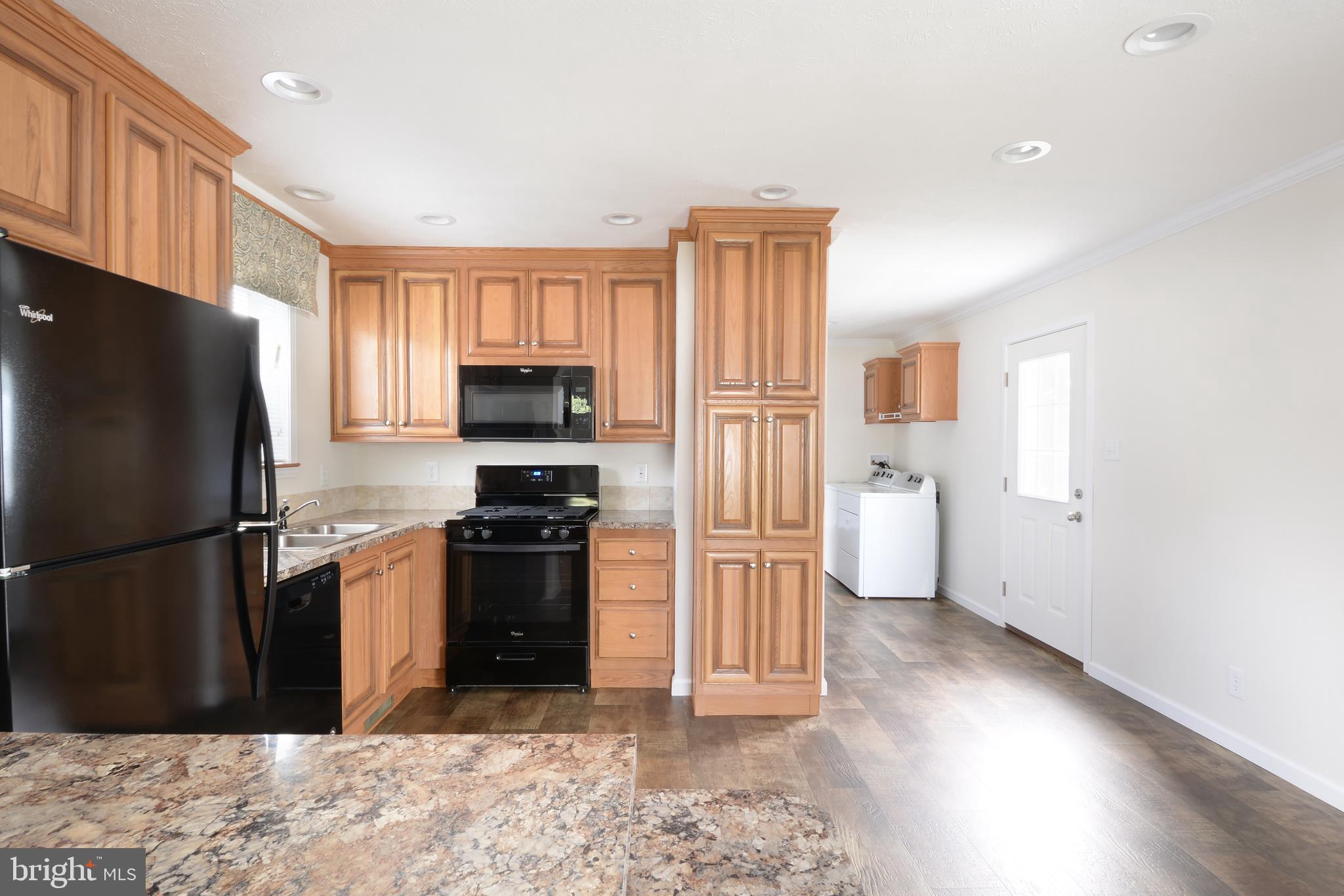 57 Marshview Drive Magnolia, DE 19962 - Photo 4 of 8 a kitchen with a refrigerator and a stove top oven