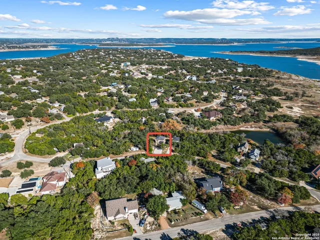 an aerial view of residential building with parking space