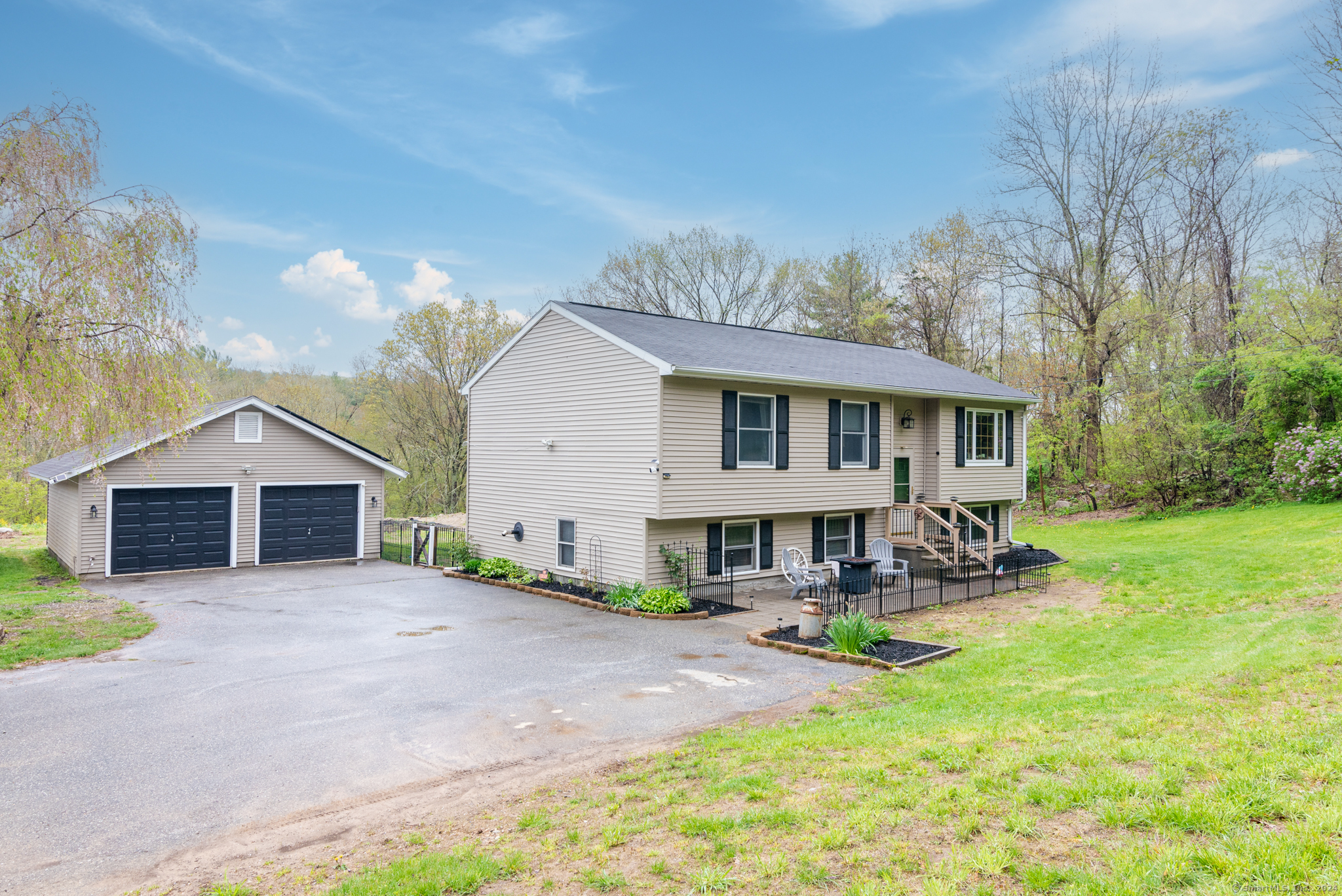 278 Snake Meadow Road Plainfield, CT 06354 - Photo 1 of 1 a view of a house with sitting area and garden