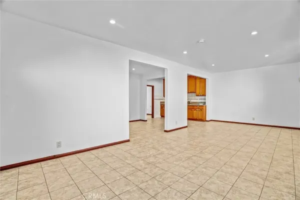 a kitchen with stainless steel appliances granite countertop a sink a stove and cabinets