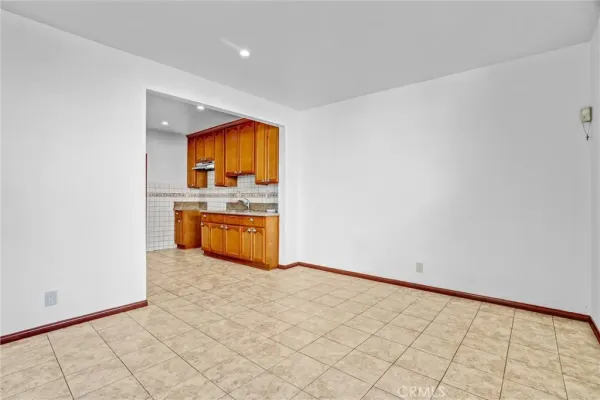 an empty room that has a glass door and a bathroom view