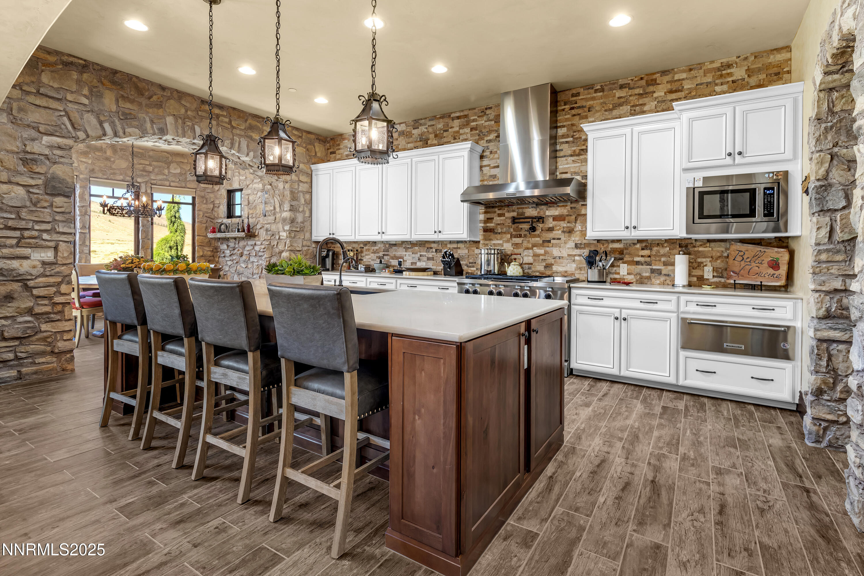 3166 Vista Favoloso Reno, NV 89519 - Photo 12 of 81 a kitchen with cabinets a sink and chairs