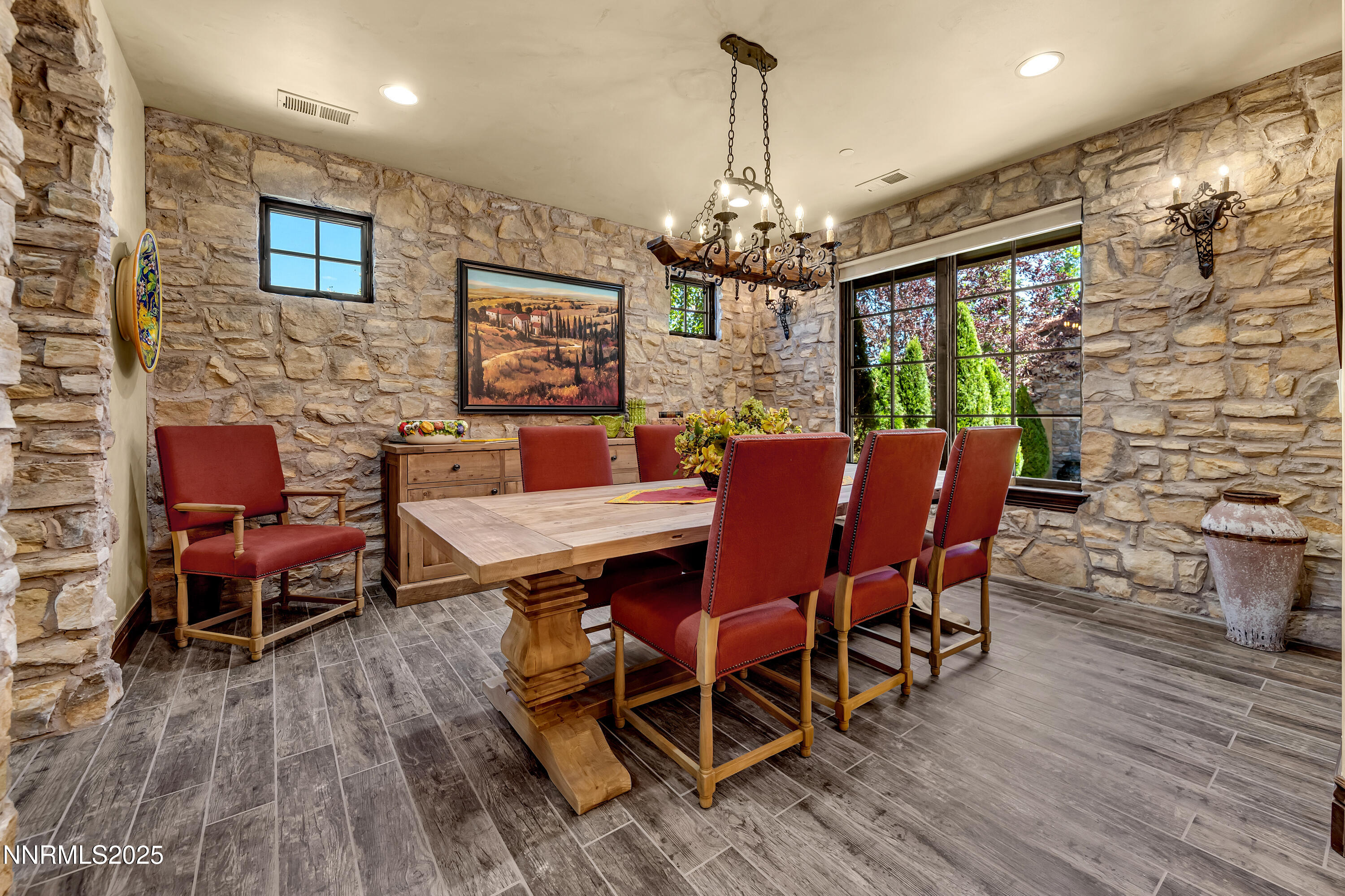 3166 Vista Favoloso Reno, NV 89519 - Photo 21 of 81 a view of a dining room with furniture a chandelier and wooden floor