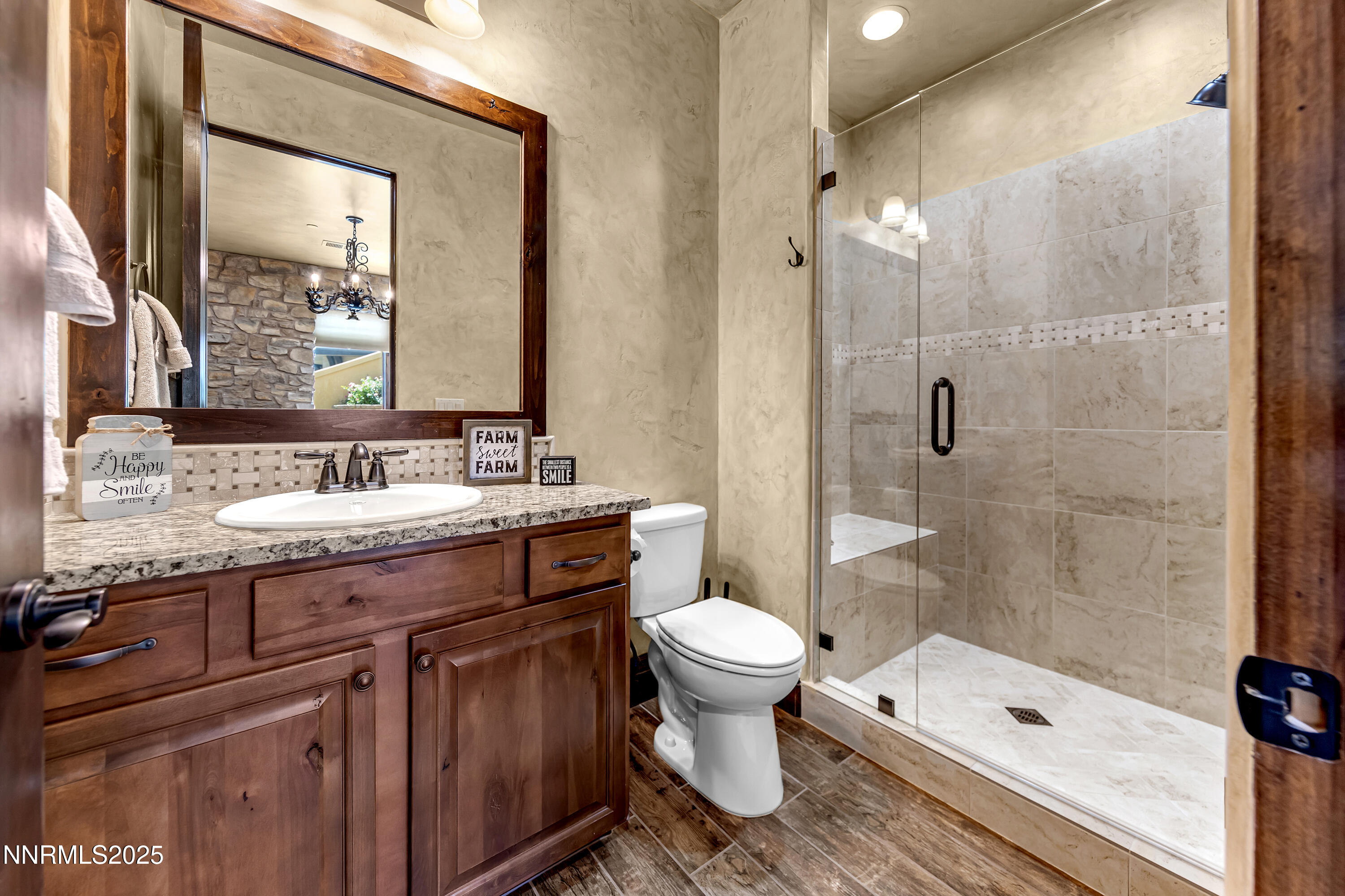 3166 Vista Favoloso Reno, NV 89519 - Photo 48 of 81 a bathroom with a granite countertop toilet sink and mirror