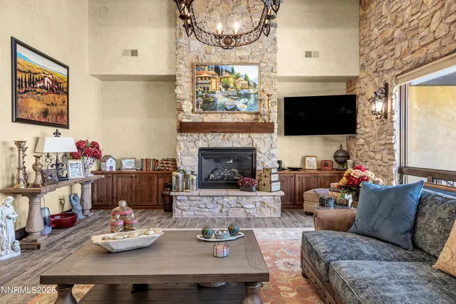 a kitchen with stainless steel appliances kitchen island granite countertop a table chairs sink and cabinets