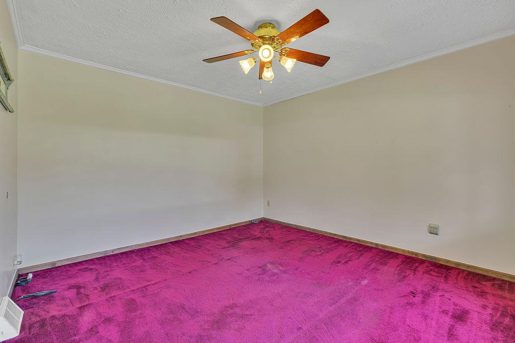 4706 Rochester Road New Brighton, PA 15066 - Photo 8 of 28 Living room has ceiling fan and is ready for your favorite sofa and chair.