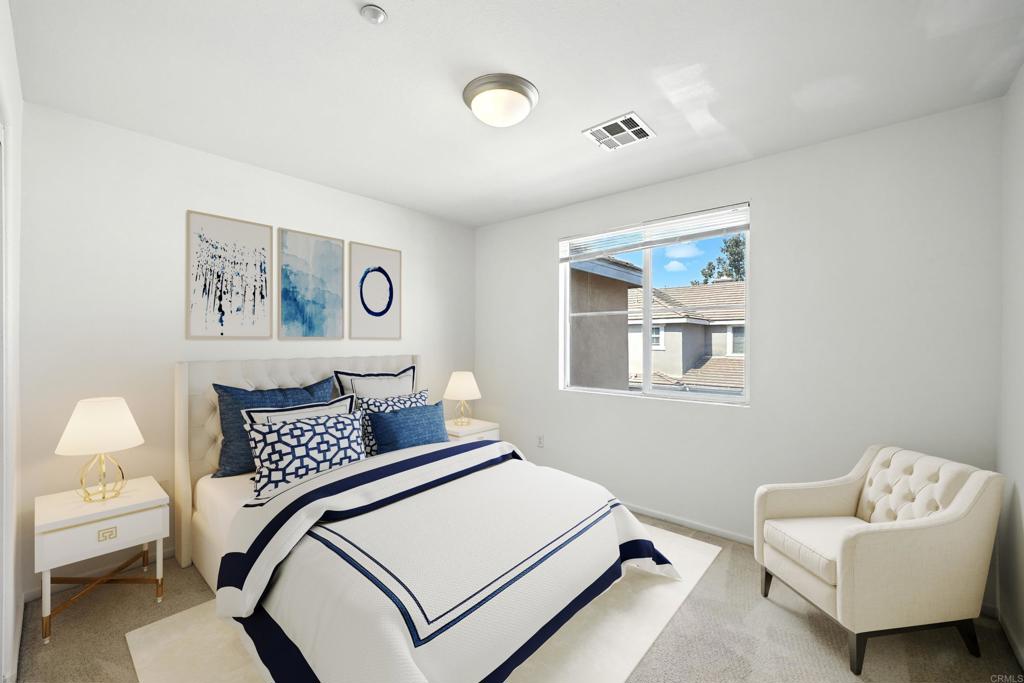 1569 Hackberry Place Chula Vista, CA 91915 - Photo 12 of 23 a bedroom with a bed and a couch