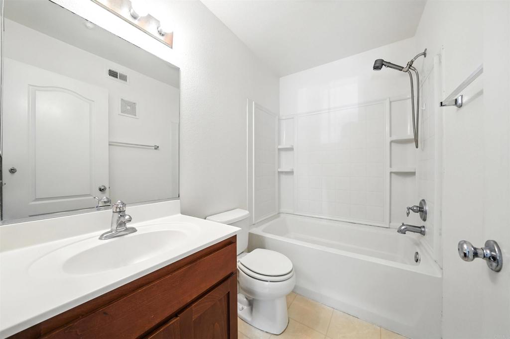 1569 Hackberry Place Chula Vista, CA 91915 - Photo 13 of 23 a bathroom with a sink a toilet and shower