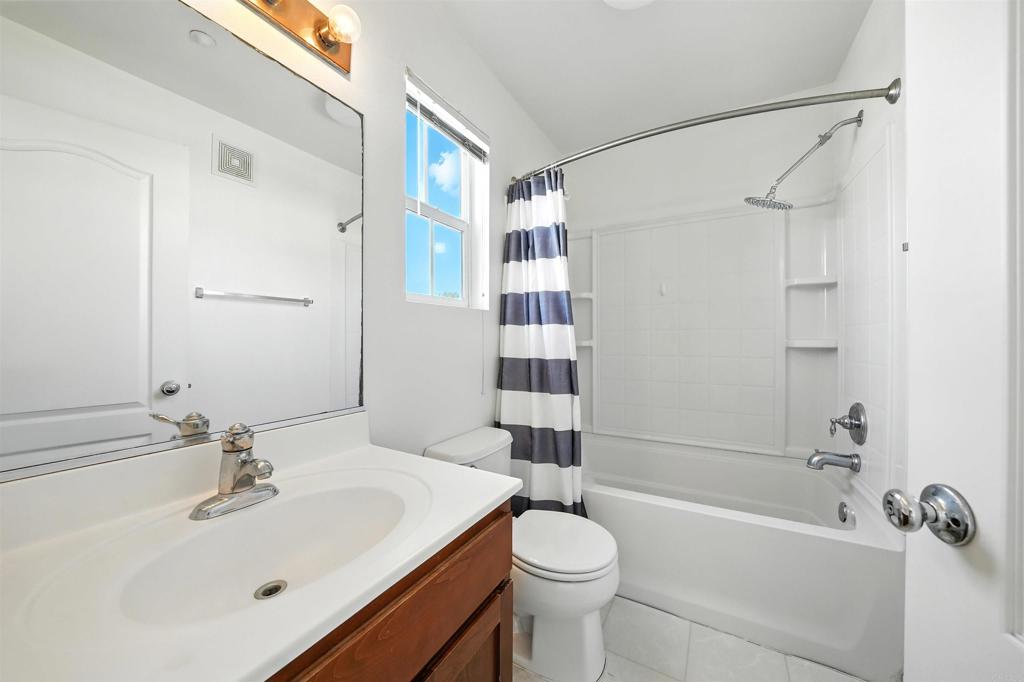 1569 Hackberry Place Chula Vista, CA 91915 - Photo 15 of 23 a bathroom with a sink toilet and shower