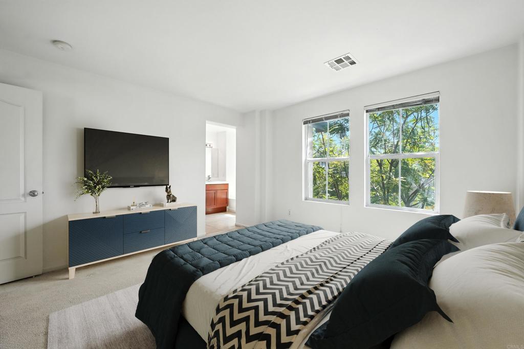 1569 Hackberry Place Chula Vista, CA 91915 - Photo 7 of 23 a bedroom with a bed and a flat screen tv