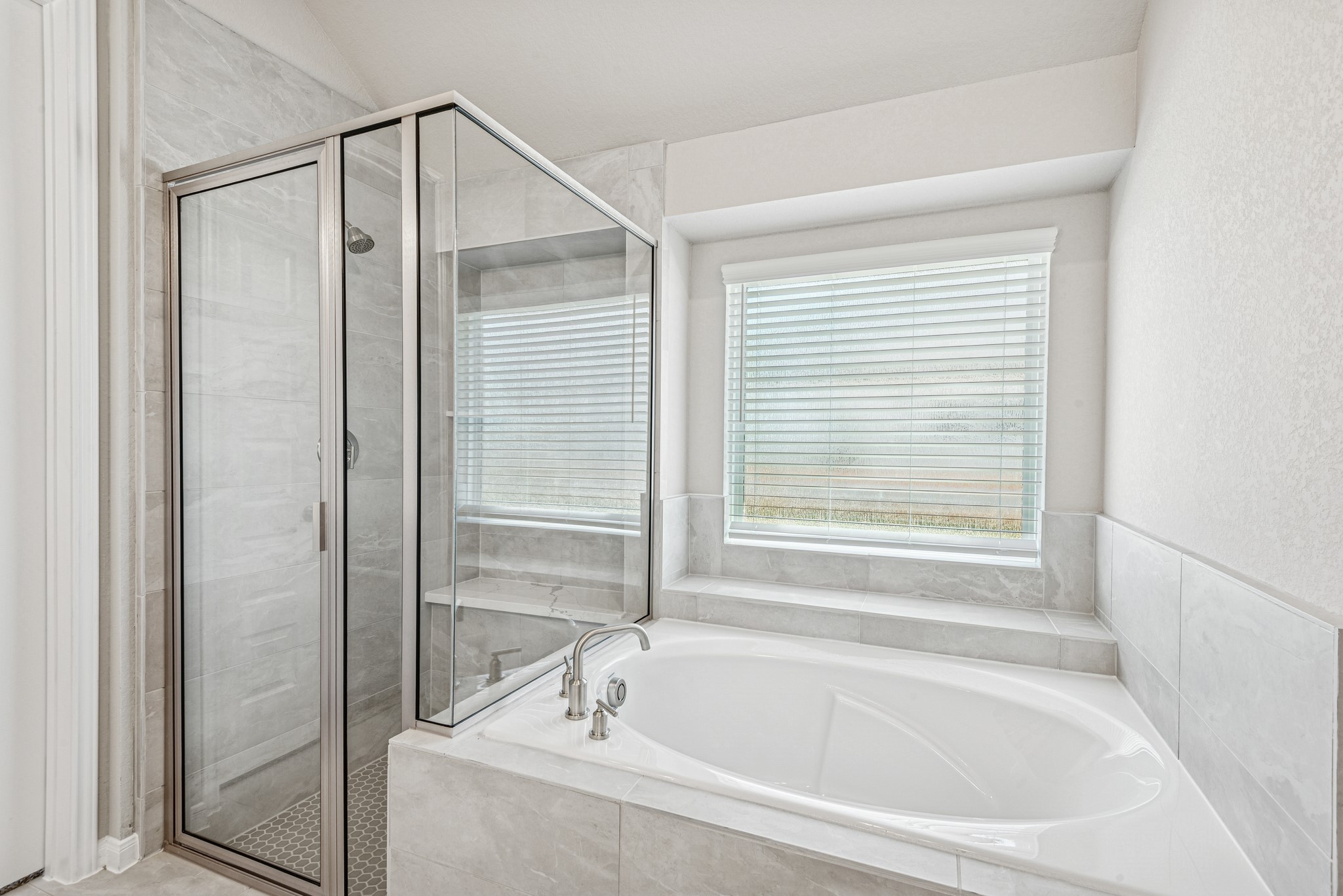 6715 Allens Landing Needville, TX 77461 - Photo 13 of 40 a bathroom with a bathtub and a shower