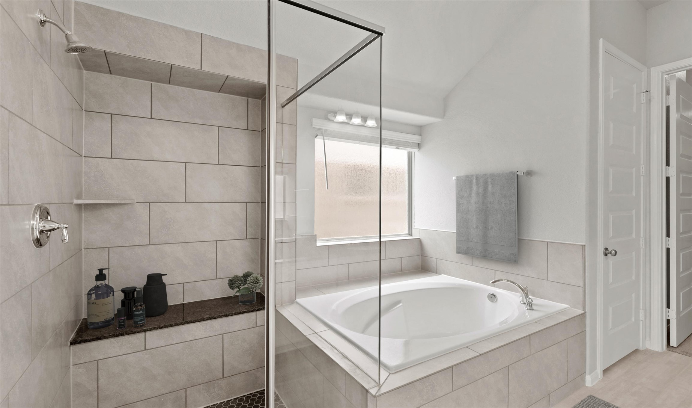 6715 Allens Landing Needville, TX 77461 - Photo 32 of 40 a bathroom with a tub a sink and a shower