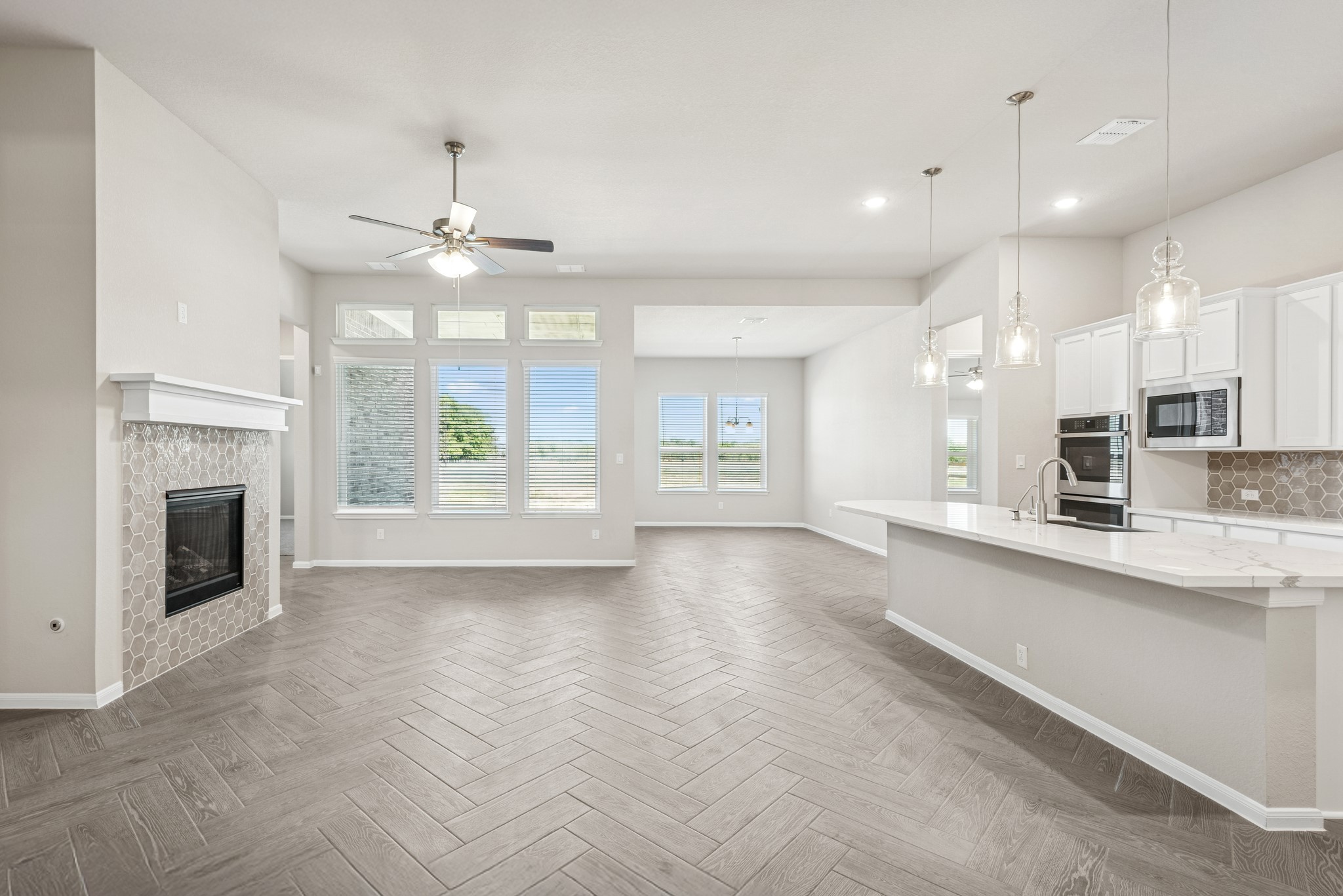 6715 Allens Landing Needville, TX 77461 - Photo 5 of 40 a view of a kitchen with a sink and a fireplace