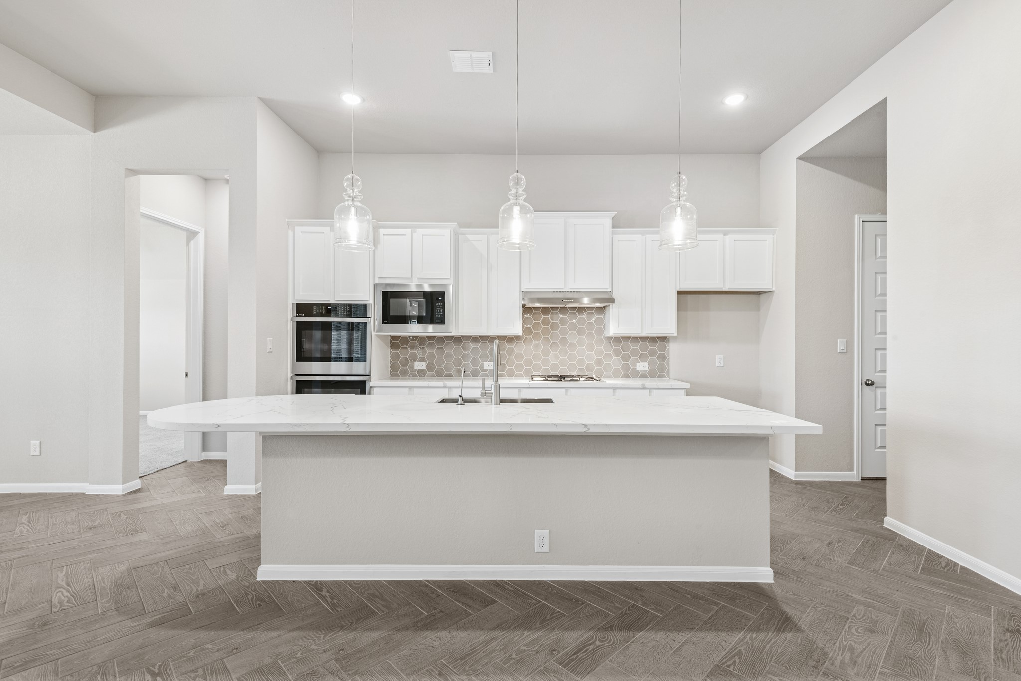 6715 Allens Landing Needville, TX 77461 - Photo 7 of 40 a kitchen with kitchen island stainless steel appliances a sink stove and cabinets