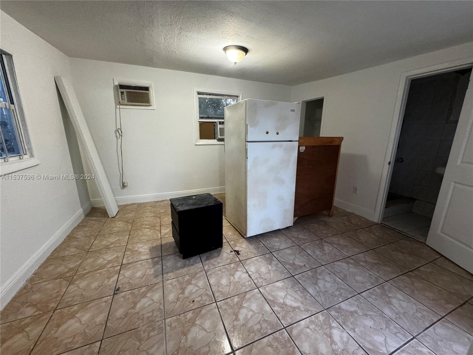 1060 Northwest 116th Street, Unit 3 Miami, FL 33168 - Photo 3 of 4 a view of a storage & utility room