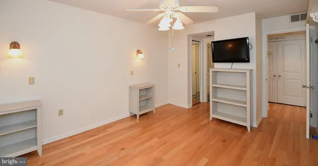 a view of a livingroom with wooden floor