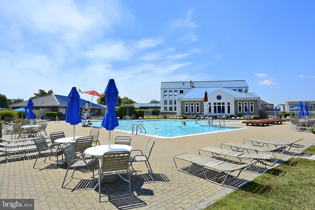 a view of a swimming pool with a patio