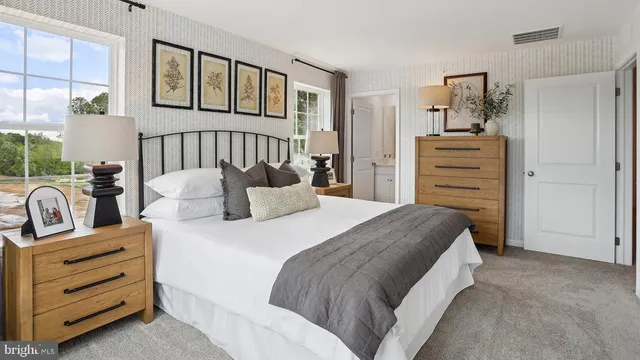 a bedroom with a bed and furniture