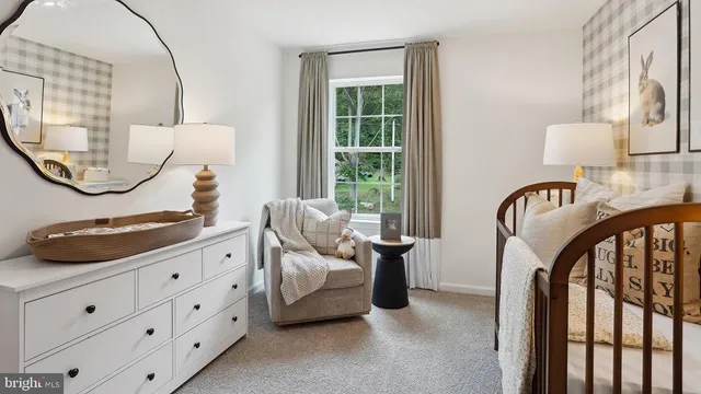 a bedroom with furniture and a mirror