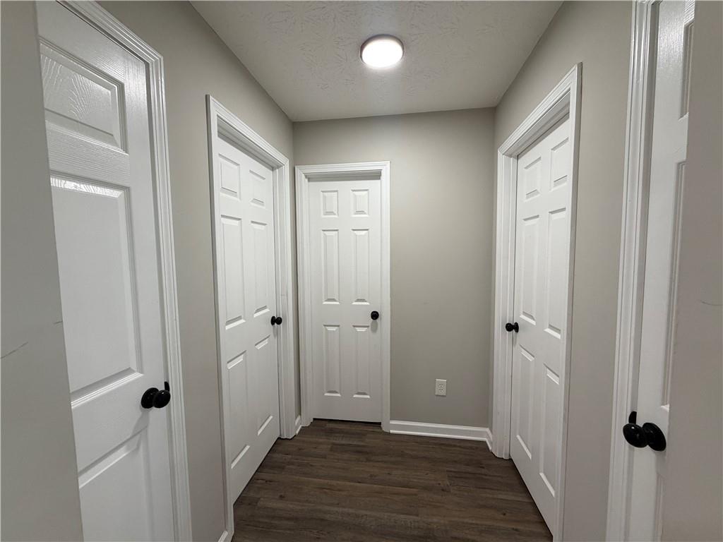 934 Bay Ridge Drive Lawrenceville, GA 30045 - Photo 42 of 78 a view of a hallway with wooden floor and closet area