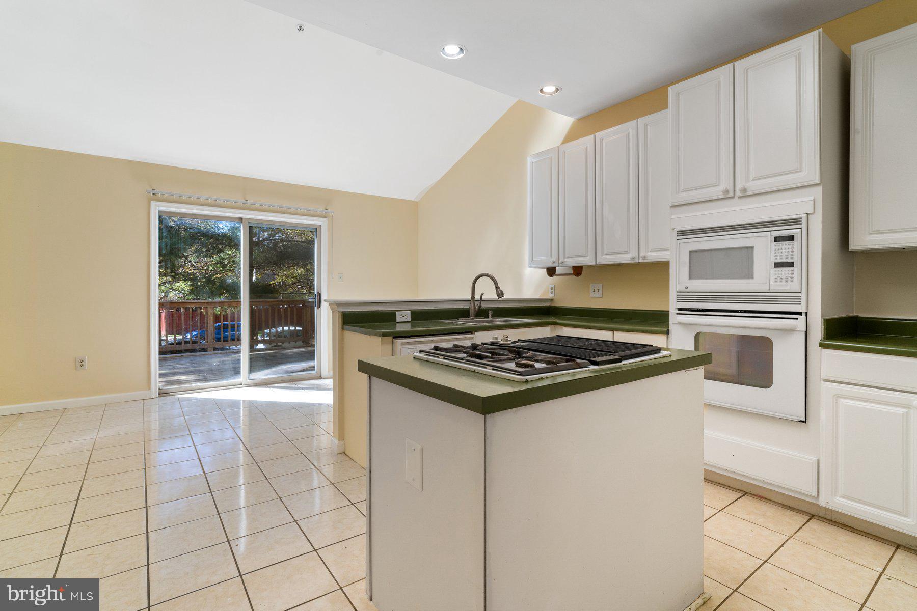 11 Bank Spring Court Owings Mills, MD 21117 - Photo 11 of 35 a kitchen with a stove a sink and a refrigerator