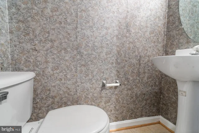 a bathroom with a toilet and a sink