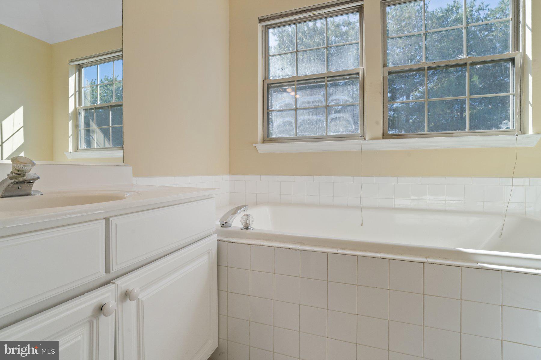 11 Bank Spring Court Owings Mills, MD 21117 - Photo 19 of 35 a bathroom with a sink and a bathtub