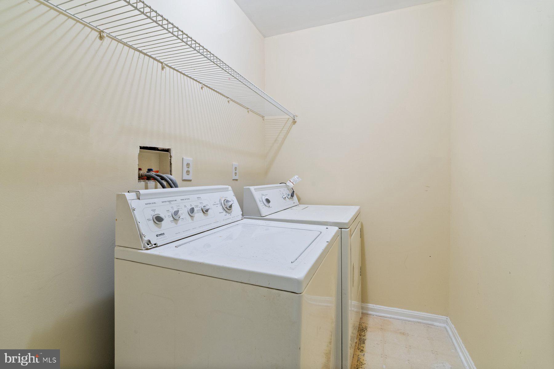 11 Bank Spring Court Owings Mills, MD 21117 - Photo 23 of 35 a utility room with dryer and washer