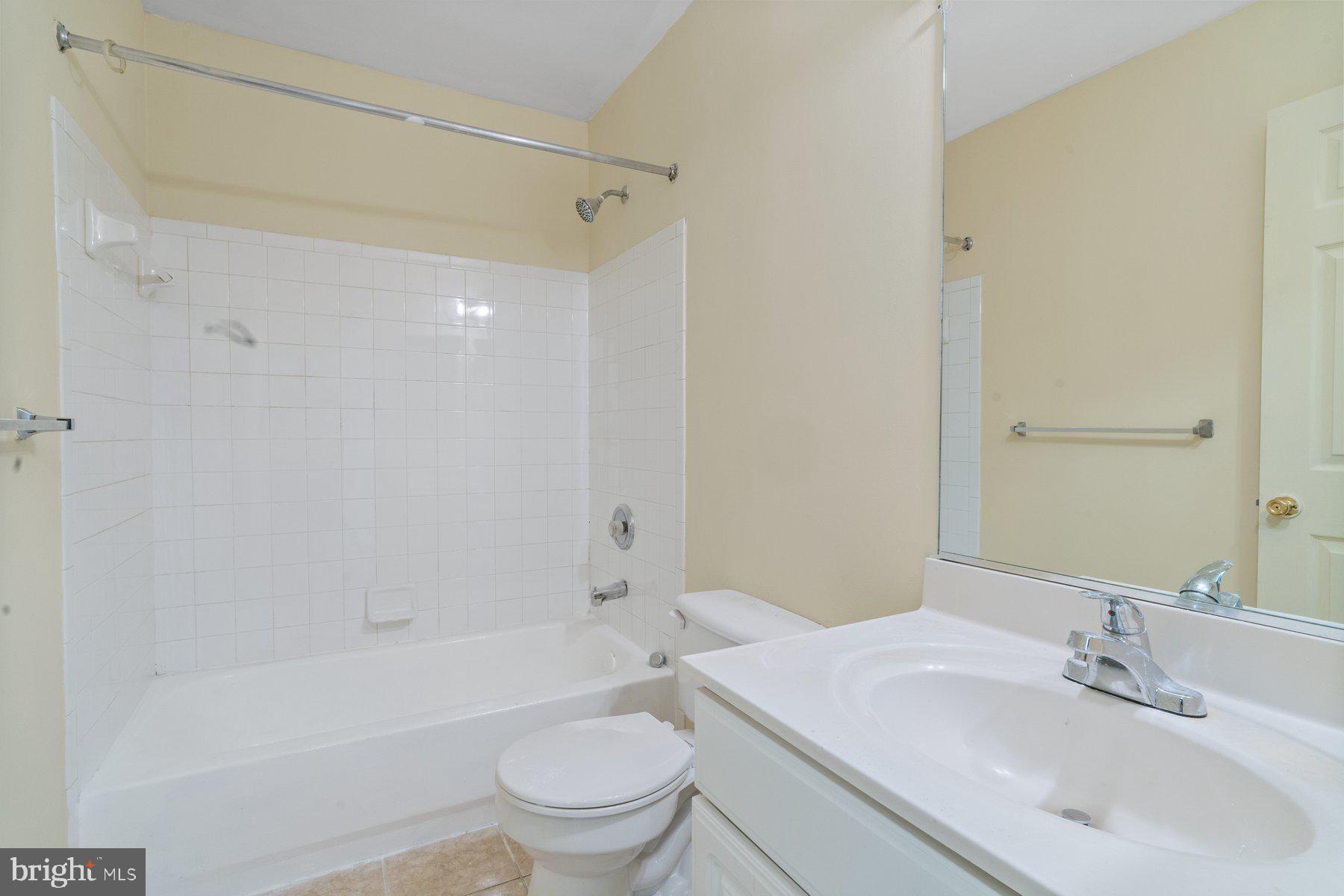 11 Bank Spring Court Owings Mills, MD 21117 - Photo 24 of 35 a bathroom with a sink toilet and shower