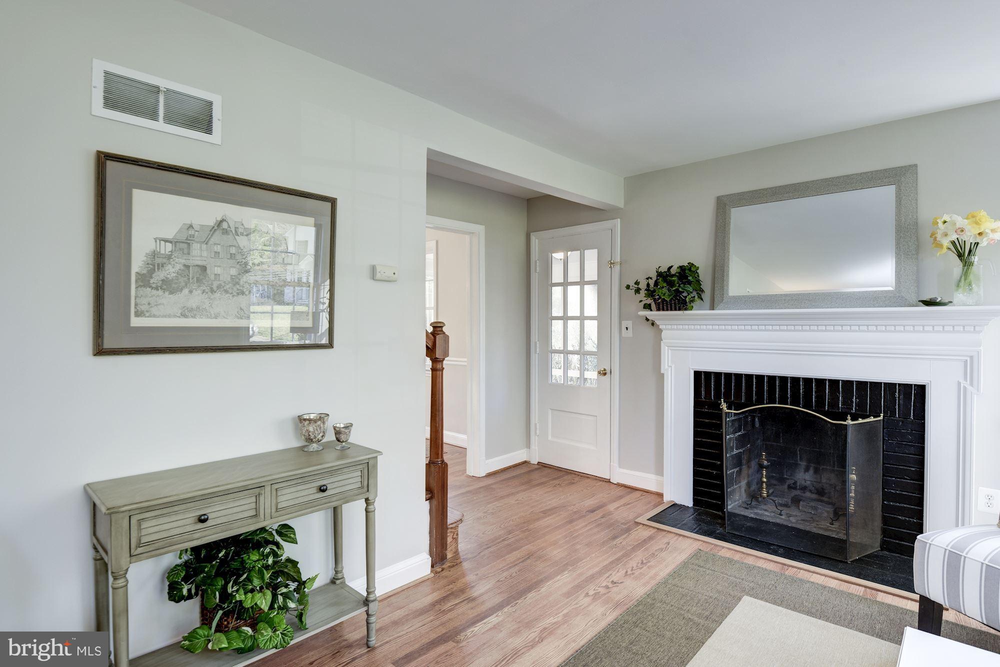 5909 Gloster Road Bethesda, MD 20816 - Photo 16 of 39 Living room w/access to side porch & dining room