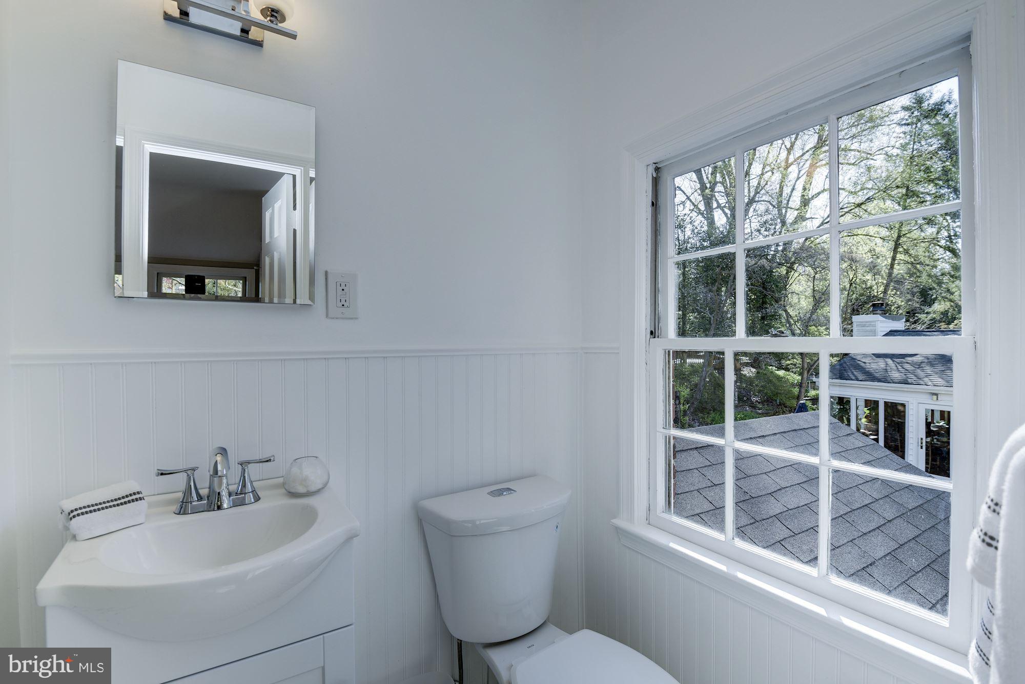 5909 Gloster Road Bethesda, MD 20816 - Photo 23 of 39 Master bathroom w/ dual flush toilet, wainscotting