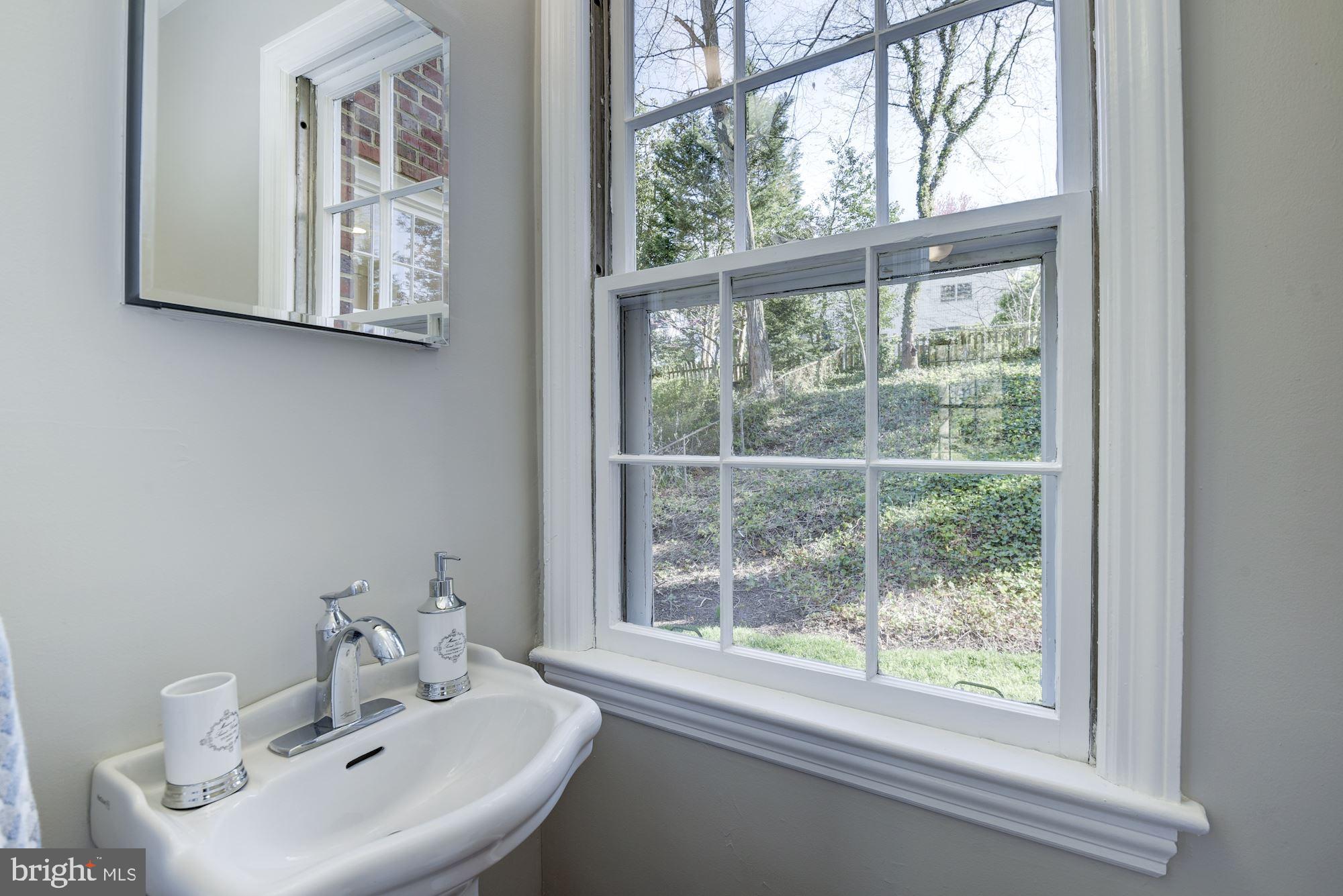 5909 Gloster Road Bethesda, MD 20816 - Photo 10 of 39 Half bath on Main Level off of Den/Rec room