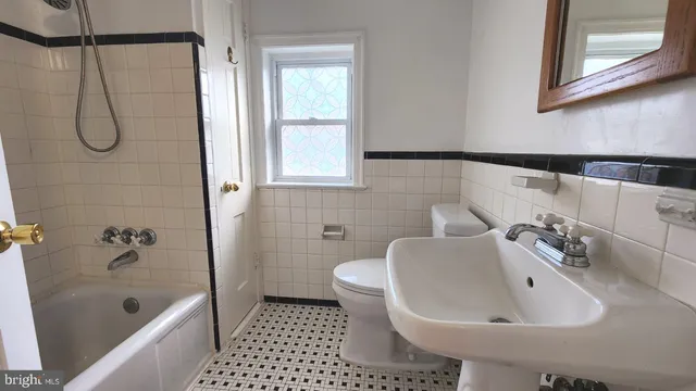 a view of a kitchen with a sink and a window