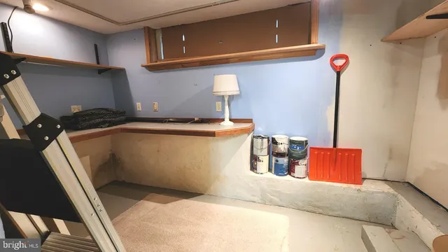 a view of a bench in front of house