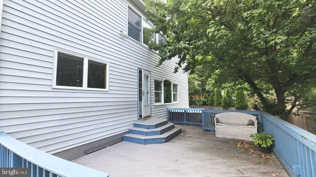 a view of deck with wooden floor and outdoor seating