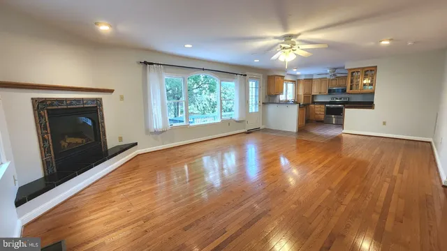 a view of a kitchen with a stove cabinets and wooden floor