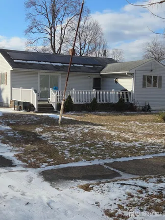 a view of a house with backyard