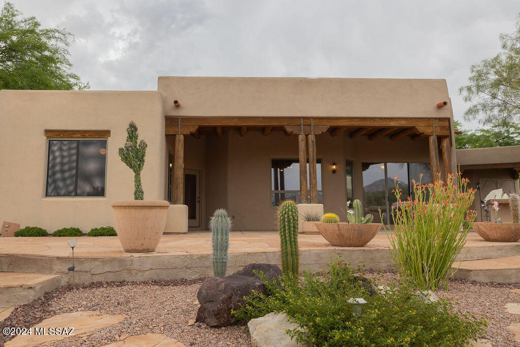 771 West Sedona Ridge Place Oro Valley, AZ 85755 - Photo 16 of 22 a front view of a house with garden