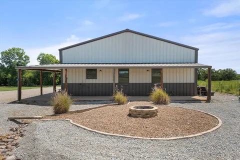 a backyard of house with seating space
