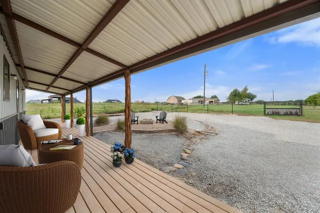 a view of a deck with wooden floor and outer view