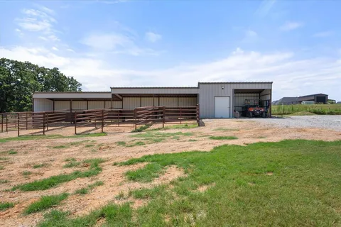 a swimming pool with outdoor seating and yard