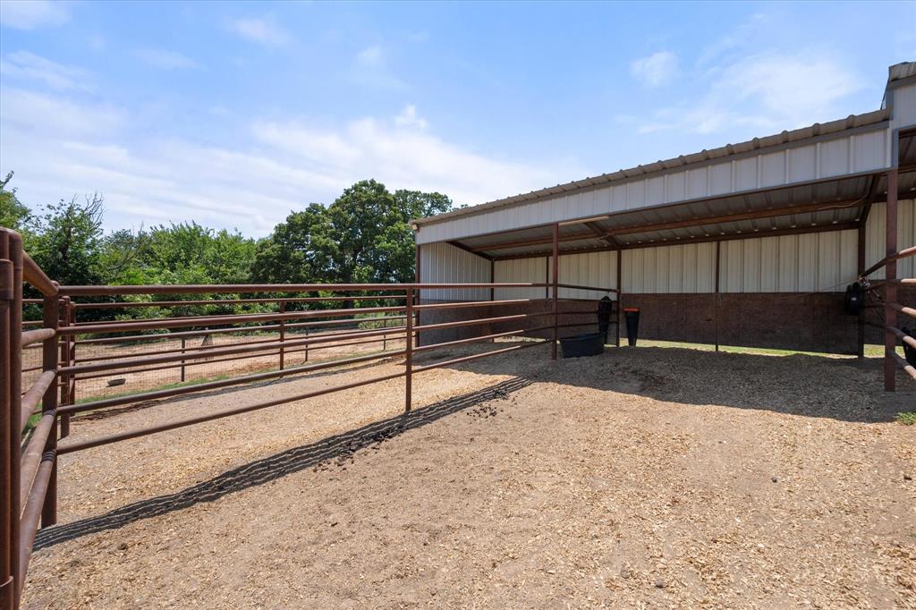 845 North Cardinal Road Azle, TX 76020 - Photo 26 of 37 a view of a street with wooden fence