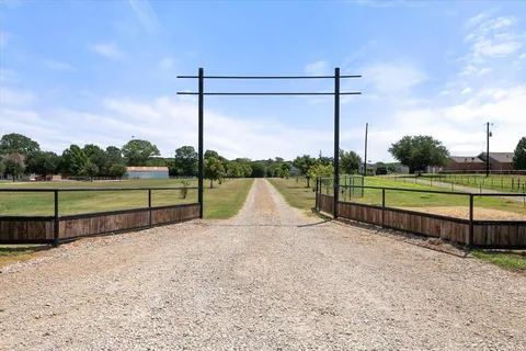 a view of park with a fence