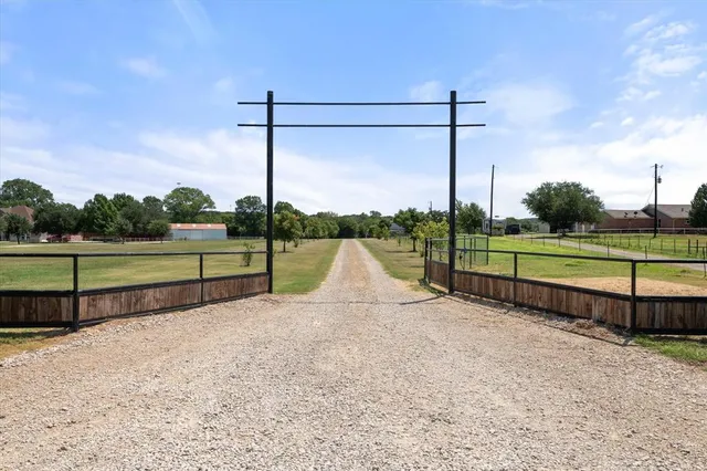 a view of park with a fence