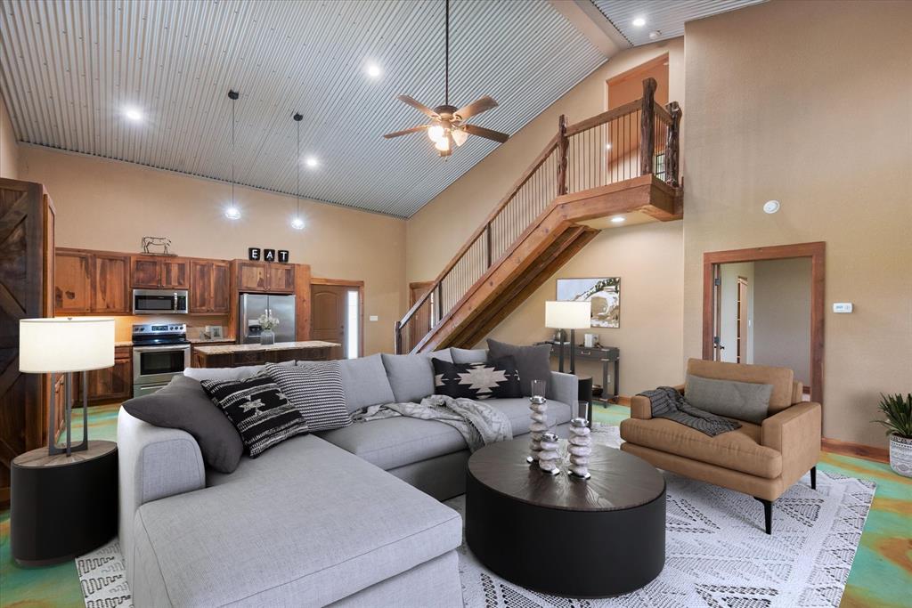 845 North Cardinal Road Azle, TX 76020 - Photo 4 of 37 a living room with furniture kitchen view and a chandelier