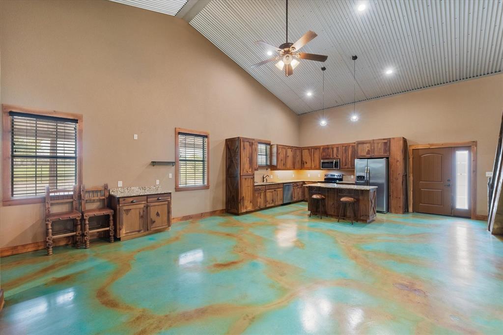 845 North Cardinal Road Azle, TX 76020 - Photo 7 of 37 a large kitchen with a table and chairs