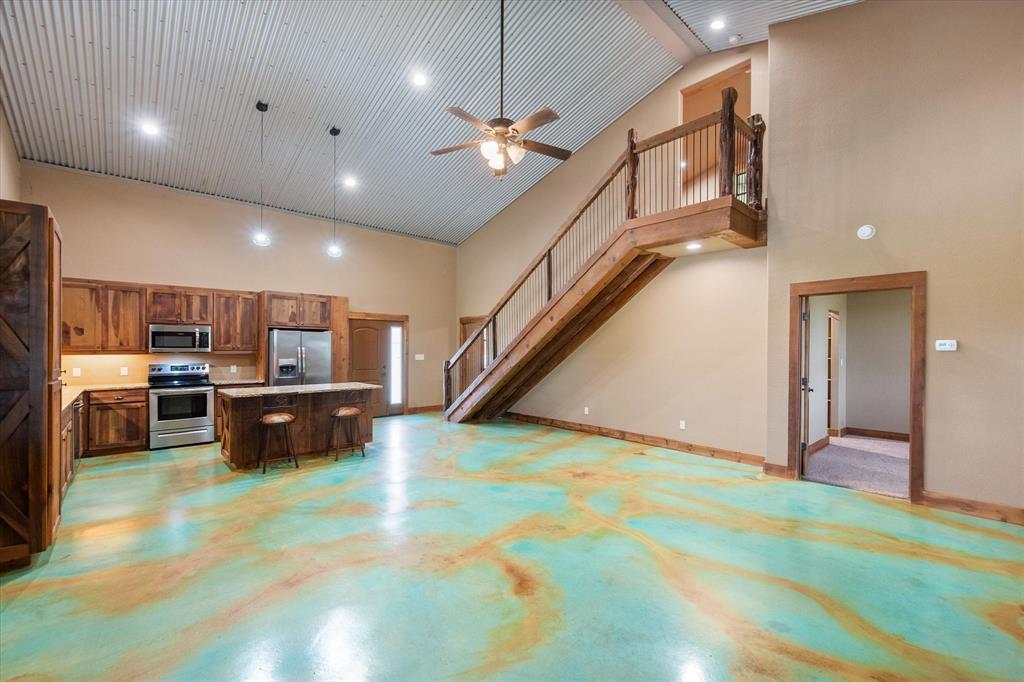 845 North Cardinal Road Azle, TX 76020 - Photo 8 of 37 a kitchen with stainless steel appliances kitchen island a refrigerator and a sink